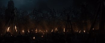 Movie still from “Maleficent” (2014), directed by Robert Stromberg – A group of people standing in a dark room; Extreme Wide shot, High angle