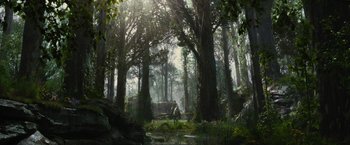 Movie still from “Maleficent” (2014), directed by Robert Stromberg – A man riding a horse through a forest; Extreme Wide shot, Low angle