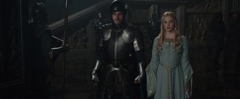 Movie still from “Maleficent” (2014), directed by Robert Stromberg – A man and a woman dressed in medieval costumes; Medium shot, Over the shoulder angle