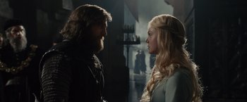 Movie still from “Maleficent” (2014), directed by Robert Stromberg – A man and a woman standing next to each other; Medium shot, Over the shoulder angle