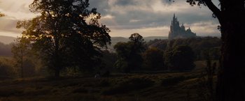 Movie still from “Maleficent” (2014), directed by Robert Stromberg – A horse is standing in the middle of a field; Extreme Wide shot, Low angle