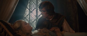 Movie still from “Maleficent” (2014), directed by Robert Stromberg – A man and a woman are looking at one another; Close Up shot, Over the shoulder angle