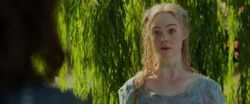 Movie still from “Maleficent: Mistress of Evil” (2019), directed by Joachim Rønning – A woman with long blonde hair wearing a blue dress; Close Up shot, Over the shoulder angle