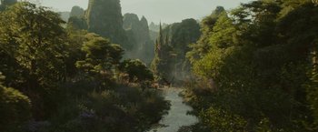 Movie still from “Maleficent: Mistress of Evil” (2019), directed by Joachim Rønning – A river running through a lush green forest; Extreme Wide shot, High angle