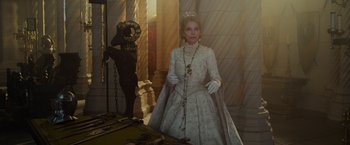 Movie still from “Maleficent: Mistress of Evil” (2019), directed by Joachim Rønning – A woman dressed in a white dress and a crown; Medium shot, Low angle