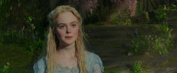 Movie still from “Maleficent: Mistress of Evil” (2019), directed by Joachim Rønning – A woman with long blonde hair wearing a blue dress; Close Up shot, Over the shoulder angle