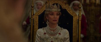 Movie still from “Maleficent: Mistress of Evil” (2019), directed by Joachim Rønning – A woman wearing a tiara and a crown; Close Up shot, Over the shoulder angle