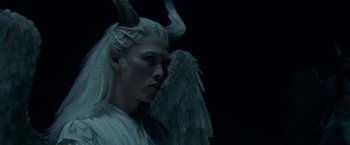 Movie still from “Maleficent: Mistress of Evil” (2019), directed by Joachim Rønning – A man with a white wig and horns on his head; Close Up shot, High angle