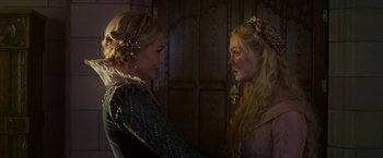Movie still from “Maleficent: Mistress of Evil” (2019), directed by Joachim Rønning – Two women in medieval garb looking at each other; Close Up shot, Over the shoulder angle
