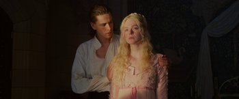 Movie still from “Maleficent: Mistress of Evil” (2019), directed by Joachim Rønning – A man and a woman standing next to each other; Medium shot, Low angle