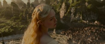 Movie still from “Maleficent: Mistress of Evil” (2019), directed by Joachim Rønning – A woman with long blonde hair wearing a white dress; Close Up shot, Over the shoulder angle