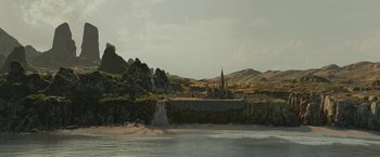 Movie still from “Maleficent: Mistress of Evil” (2019), directed by Joachim Rønning – A large body of water near a mountain; Extreme Wide shot, High angle