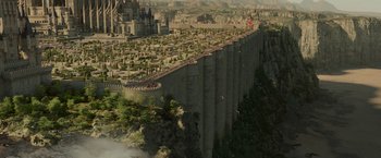 Movie still from “Maleficent: Mistress of Evil” (2019), directed by Joachim Rønning – An aerial view of a city on top of a cliff; Extreme Wide shot, High angle