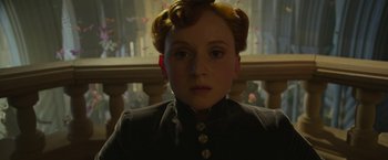 Movie still from “Maleficent: Mistress of Evil” (2019), directed by Joachim Rønning – A woman with red hair and a black jacket; Close Up shot, Low angle