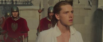 Movie still from “Maleficent: Mistress of Evil” (2019), directed by Joachim Rønning – A man in a white shirt and a man in a red shirt; Close Up shot, Low angle