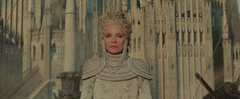 Movie still from “Maleficent: Mistress of Evil” (2019), directed by Joachim Rønning – A woman in a white dress with a crown on her head; Medium shot, Low angle