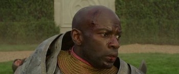 Movie still from “Maleficent: Mistress of Evil” (2019), directed by Joachim Rønning – A person with a head wound; Close Up shot, Over the shoulder angle