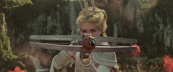 Movie still from “Maleficent: Mistress of Evil” (2019), directed by Joachim Rønning – A woman with a crown holding a sword in front of her face; Close Up shot, Over the shoulder angle