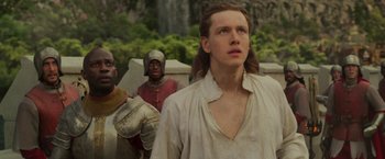 Movie still from “Maleficent: Mistress of Evil” (2019), directed by Joachim Rønning – A man with long brown hair standing next to other men; Close Up shot, Low angle