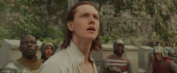 Movie still from “Maleficent: Mistress of Evil” (2019), directed by Joachim Rønning – A man with long brown hair looking up at the sky; Close Up shot, Low angle