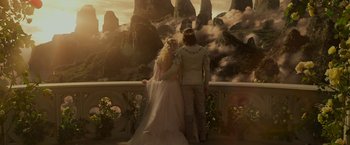 Movie still from “Maleficent: Mistress of Evil” (2019), directed by Joachim Rønning – A man and a woman standing next to each other on a balcony; Wide shot, High angle