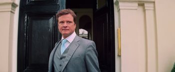 Movie still from “Mamma Mia!” (2008), directed by Phyllida Lloyd – A person wearing a suit and tie; Close Up shot, Low angle