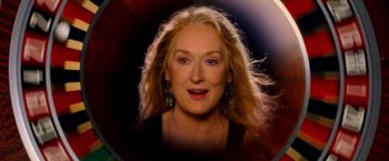 Movie still from “Mamma Mia!” (2008), directed by Phyllida Lloyd – A person with long blonde hair; Close Up shot, Overhead angle