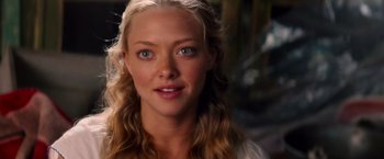 Movie still from “Mamma Mia!” (2008), directed by Phyllida Lloyd – A person with long blonde hair; Close Up shot, Over the shoulder angle