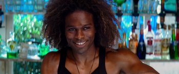 Movie still from “Mamma Mia!” (2008), directed by Phyllida Lloyd – A person with a beard smiling; Close Up shot, Overhead angle