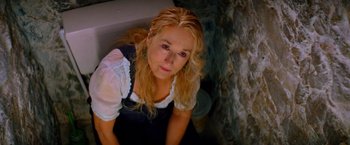 Movie still from “Mamma Mia!” (2008), directed by Phyllida Lloyd – A woman with blonde curly hair sitting in a bath tub; Close Up shot, Overhead angle