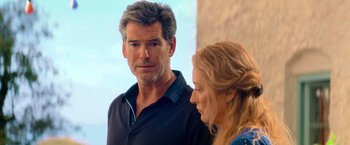 Movie still from “Mamma Mia!” (2008), directed by Phyllida Lloyd – A man and a woman standing next to each other; Close Up shot, Over the shoulder angle