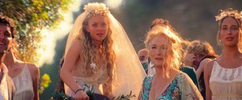 Movie still from “Mamma Mia!” (2008), directed by Phyllida Lloyd – A bride and her mother at a wedding; Close Up shot, Over the shoulder angle