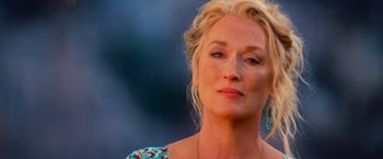Movie still from “Mamma Mia!” (2008), directed by Phyllida Lloyd – A person wearing a dress; Close Up shot, Low angle