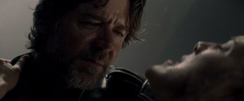 Movie still from “Man of Steel” (2013), directed by Zack Snyder – A person with a beard; Close Up shot, Over the shoulder angle