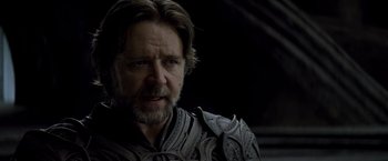 Movie still from “Man of Steel” (2013), directed by Zack Snyder – A person with a beard; Close Up shot, Over the shoulder angle