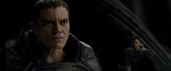 Movie still from “Man of Steel” (2013), directed by Zack Snyder – A person wearing a costume; Close Up shot, Over the shoulder angle