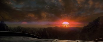 Movie still from “Man of Steel” (2013), directed by Zack Snyder – The sun is setting over a mountain range with a bird flying in the foreground; Extreme Wide shot, Low angle