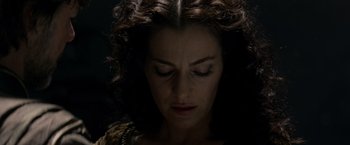 Movie still from “Man of Steel” (2013), directed by Zack Snyder – A person with curly hair looking down; Close Up shot, Overhead angle