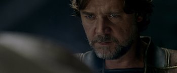 Movie still from “Man of Steel” (2013), directed by Zack Snyder – A person with a beard; Close Up shot, Over the shoulder angle