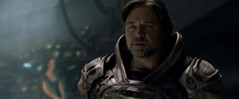 Movie still from “Man of Steel” (2013), directed by Zack Snyder – A person wearing a costume; Close Up shot, Over the shoulder angle