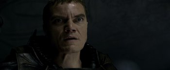 Movie still from “Man of Steel” (2013), directed by Zack Snyder – A person wearing a leather jacket; Close Up shot, Low angle