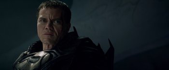 Movie still from “Man of Steel” (2013), directed by Zack Snyder – A person wearing a costume; Close Up shot, Over the shoulder angle