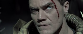 Movie still from “Man of Steel” (2013), directed by Zack Snyder – A man's face with blood on his face; Close Up shot, Low angle