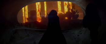 Movie still from “Man of Steel” (2013), directed by Zack Snyder – A woman standing in front of an erupting volcano; Wide shot, Over the shoulder angle