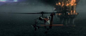Movie still from “Man of Steel” (2013), directed by Zack Snyder – A coast guard helicopter flying over the water; Extreme Wide shot, Low angle