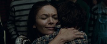 Movie still from “Man of Steel” (2013), directed by Zack Snyder – A person hugging a person; Close Up shot, Low angle