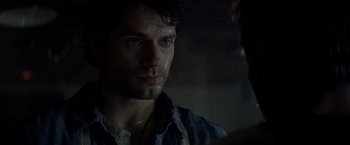 Movie still from “Man of Steel” (2013), directed by Zack Snyder – A person wearing a shirt; Close Up shot, Over the shoulder angle