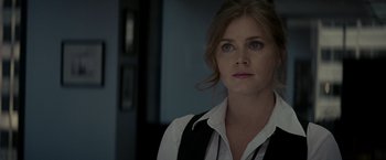 Movie still from “Man of Steel” (2013), directed by Zack Snyder – A person wearing a shirt and vest; Close Up shot, Over the shoulder angle