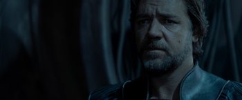 Movie still from “Man of Steel” (2013), directed by Zack Snyder – A person with a beard; Close Up shot, Over the shoulder angle