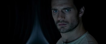 Movie still from “Man of Steel” (2013), directed by Zack Snyder – A person wearing a white shirt; Close Up shot, Over the shoulder angle